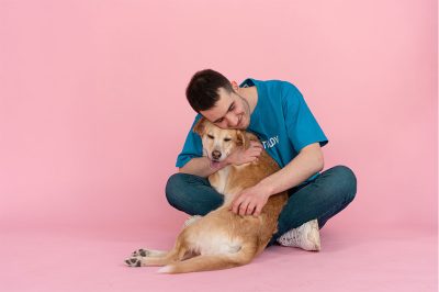 man-holding-a-dog